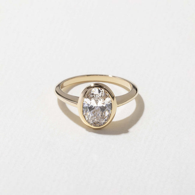 1.50 Carat Oval Cut Lab Grown Diamond Bezel Set Solitaire Ring in Solid Gold - Mivaan Fine Jewelry