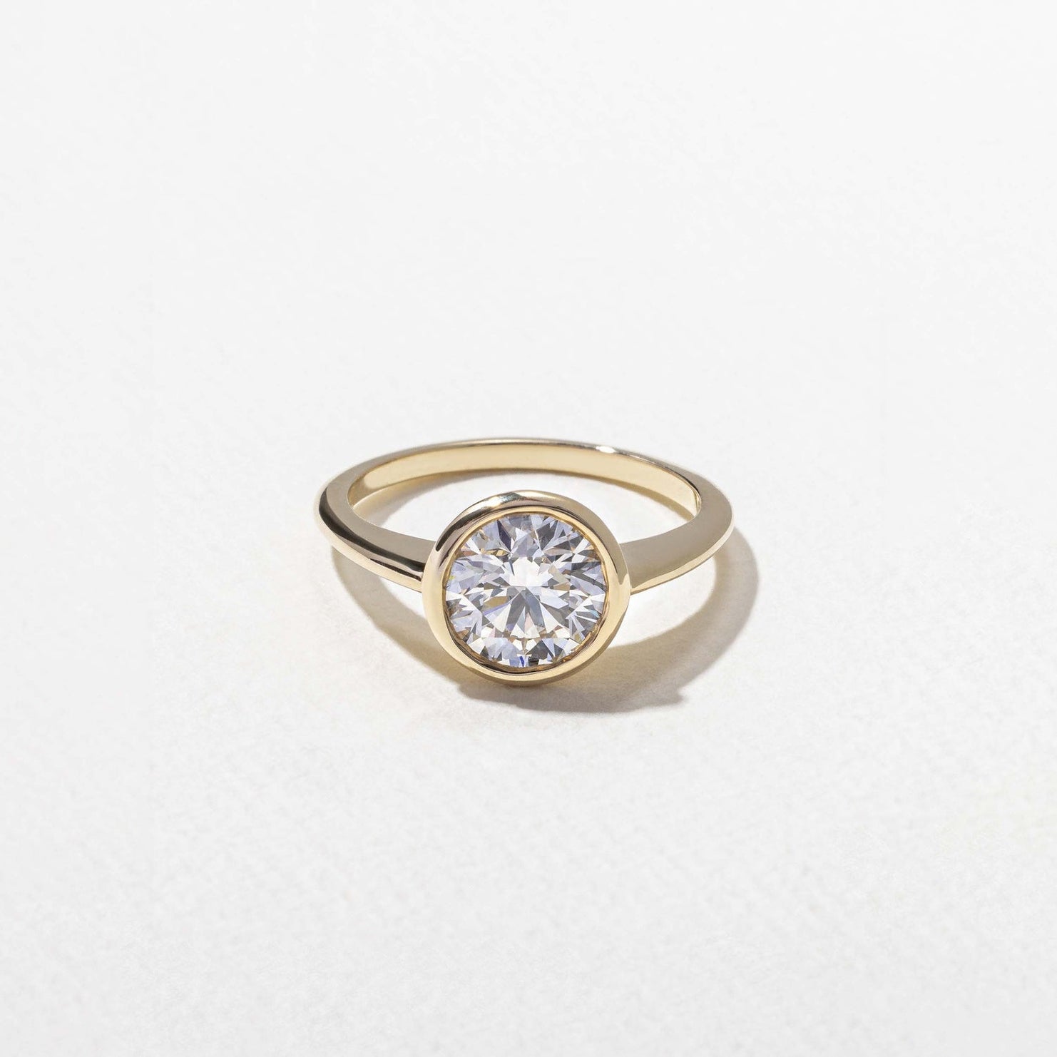 1.50 carat round cut lab grown diamond bezel set ring