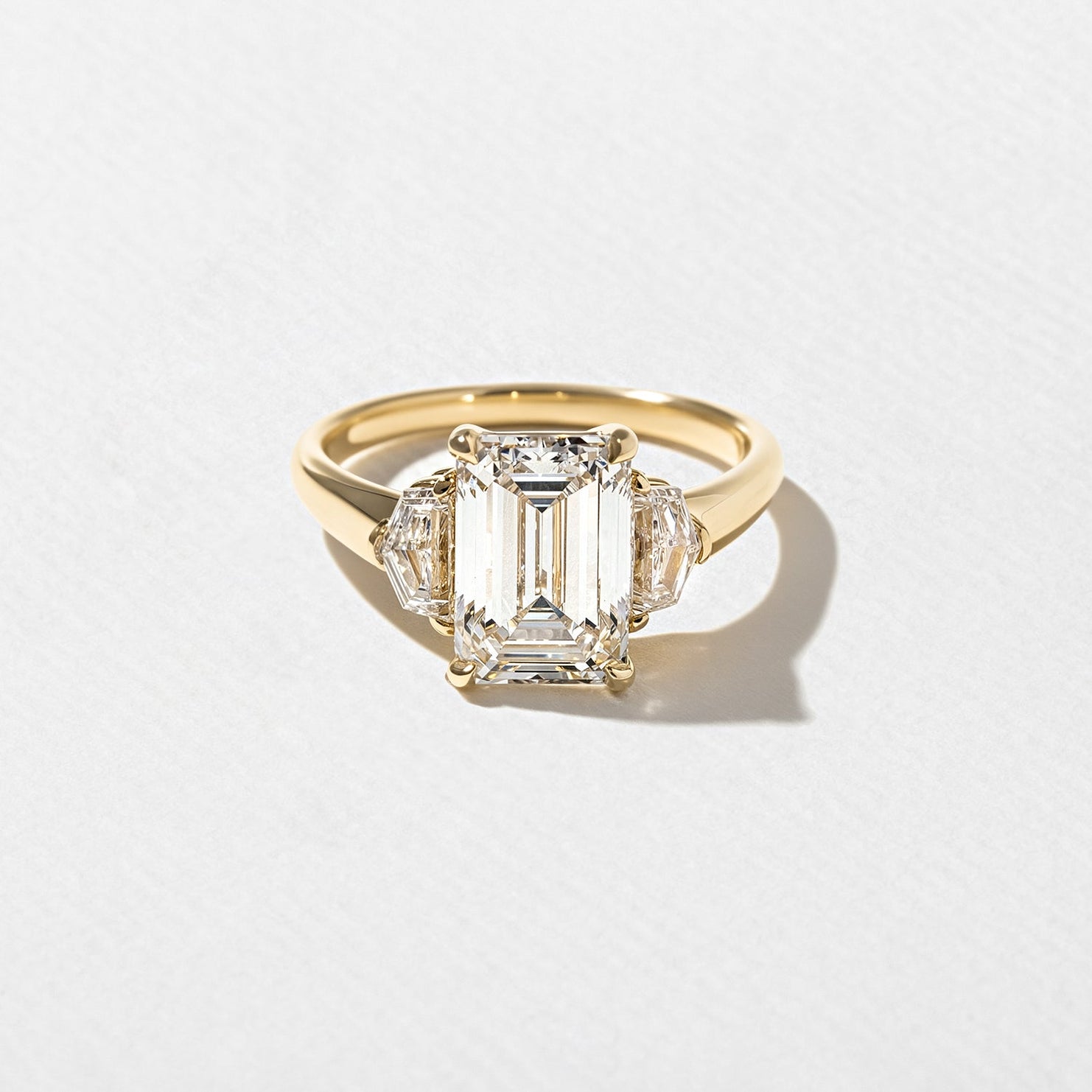 3 carat emerald cut lab grown diamond three stone ring