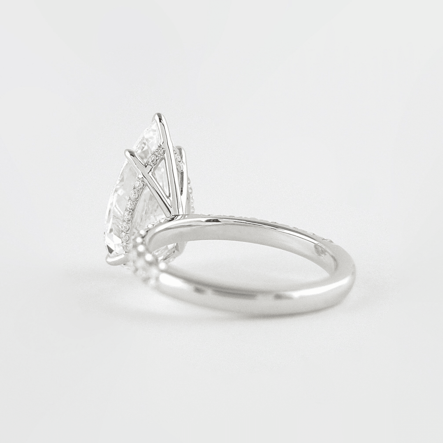 4 Carat Pear Cut Hidden Halo Diamond Ring with Pave Band Ring