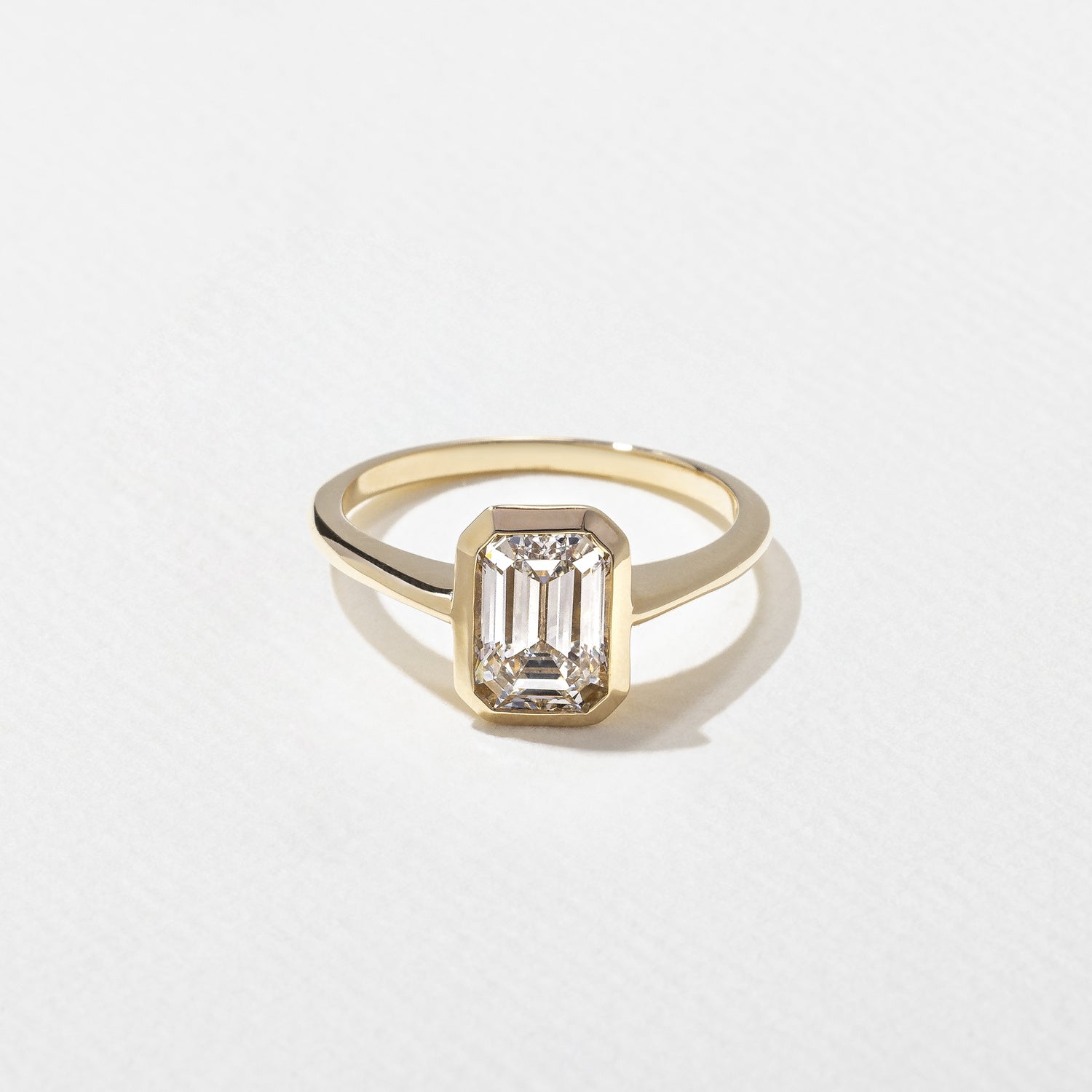 1.55 Carat Emerald Cut Lab Grown Diamond Bezel Solitaire Ring in Solid Gold