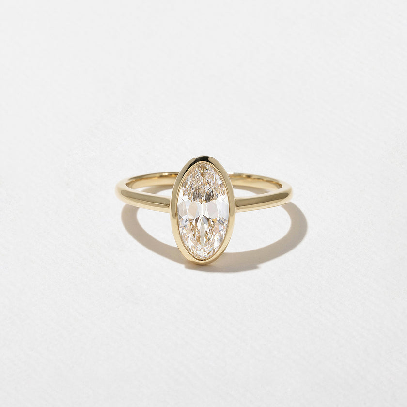 1.50 Carat Oval Cut Lab Grown Diamond Bezel Set Ring in Solid Gold